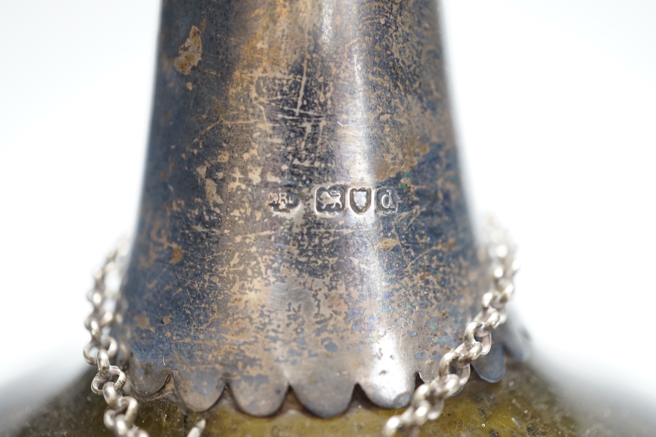 An 18th century green glass onion-shape bottle, with later silver mount, London, 1899, together with a George III silver 'S' decanter label, Phipps & Robinson, London, 1806. 17cm